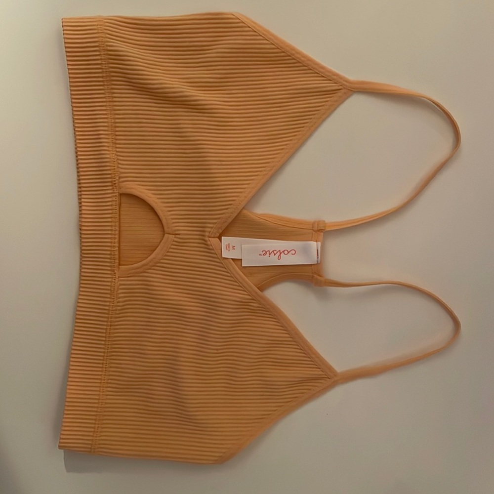 Light orange tank top. Medium but fits as s/m